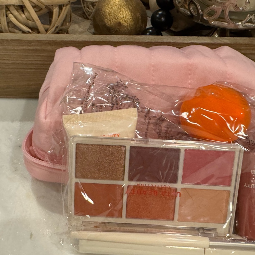 Ulta Beauty pink makeup bag with makeup included plus sponge, cream blush & lips